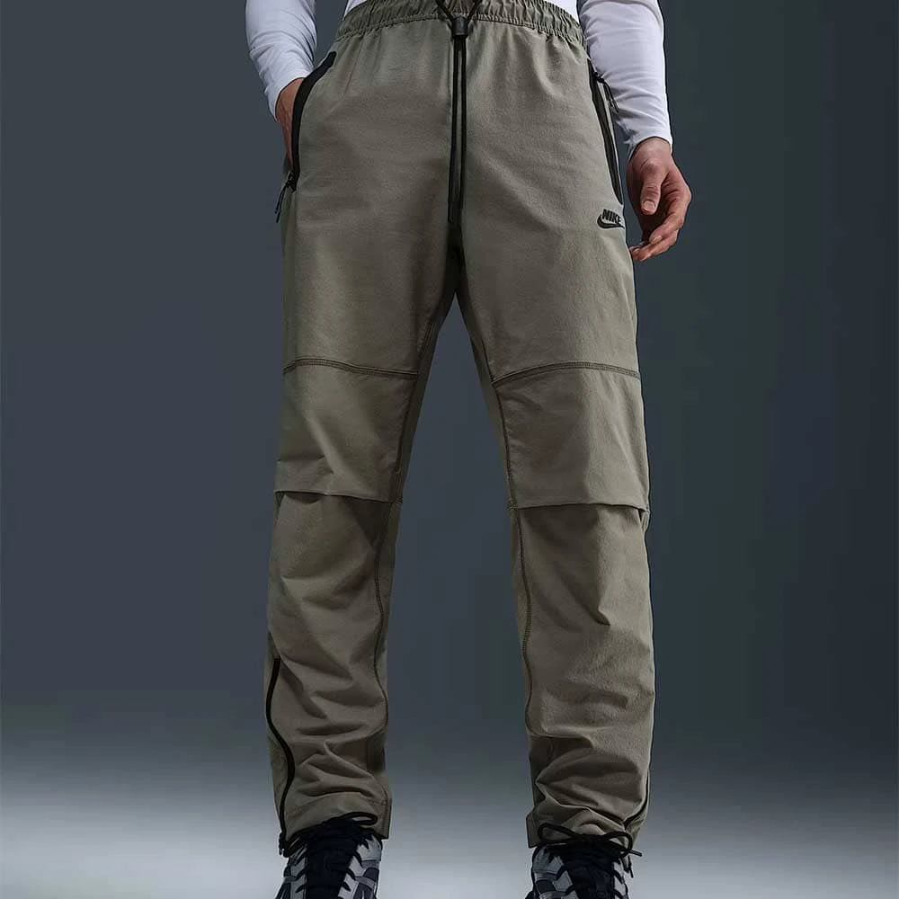 МЪЖКО ДОЛНИЩЕ NIKE HM8241-320 TCH WVN OH PANT БЛЕДОЗЕЛЕНО - lotus-sport.bg